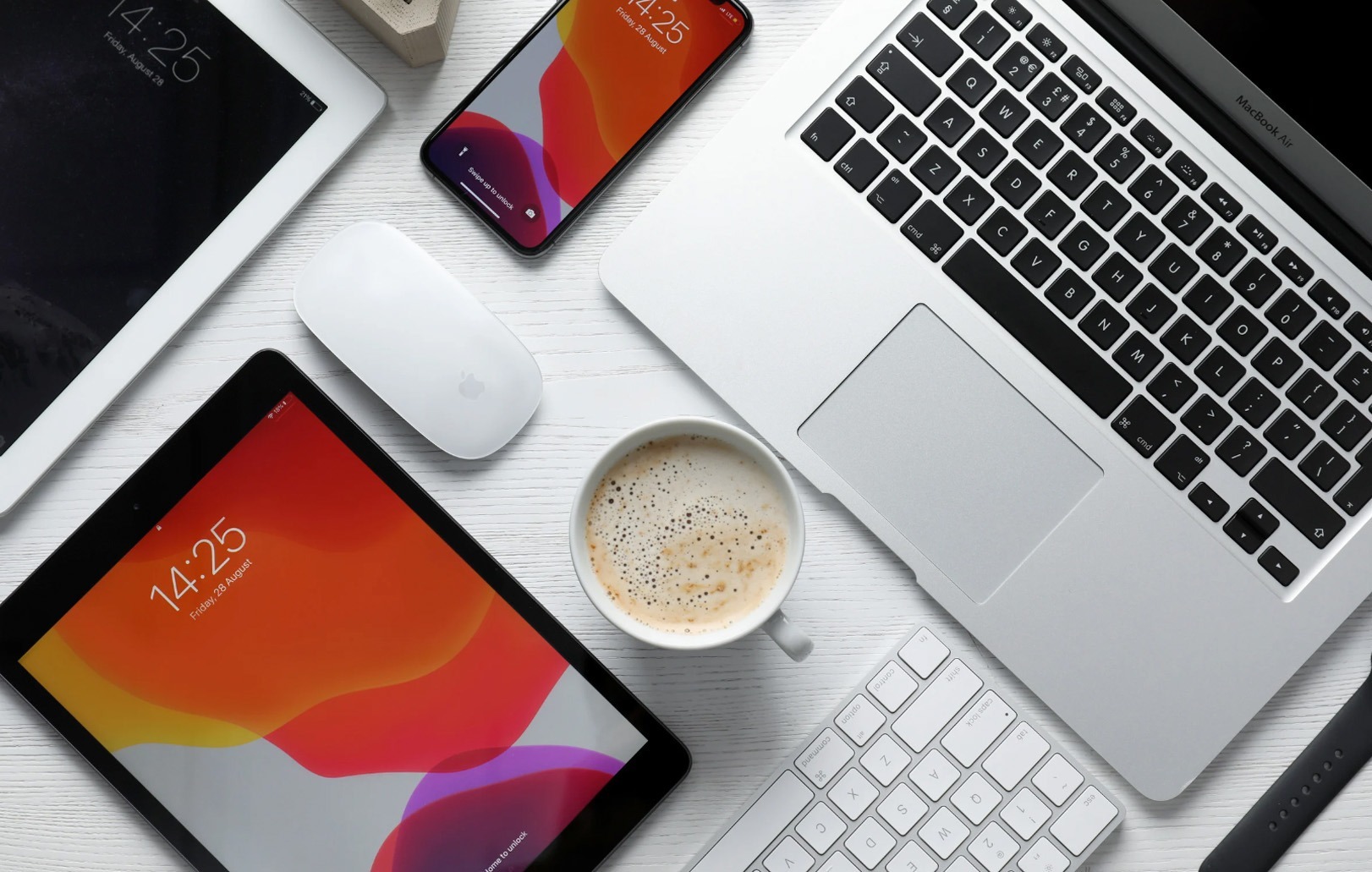 virtual assistance marketing tools with laptop, tablet, keyboard, mobile, mouse and a latte